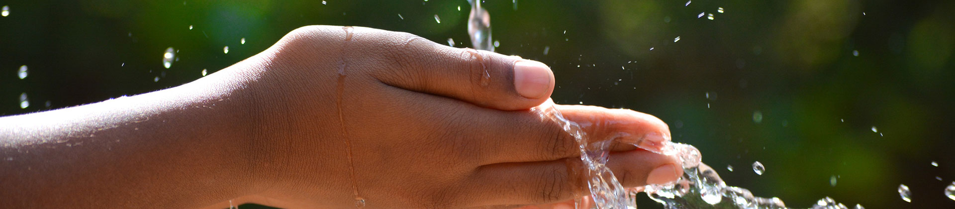 Child's Hands Capturing Pouring Water