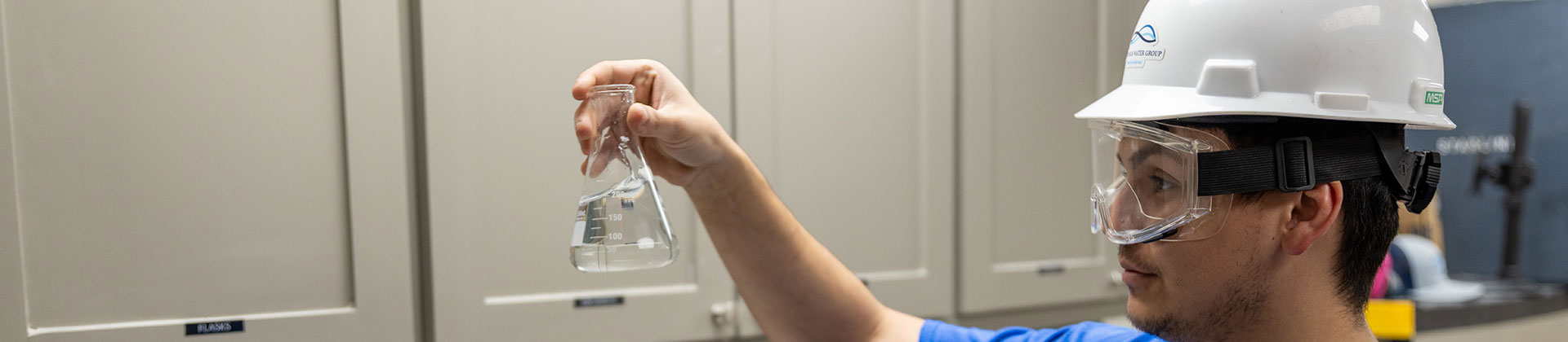 Certified water treatment operator reviewing plant performance data