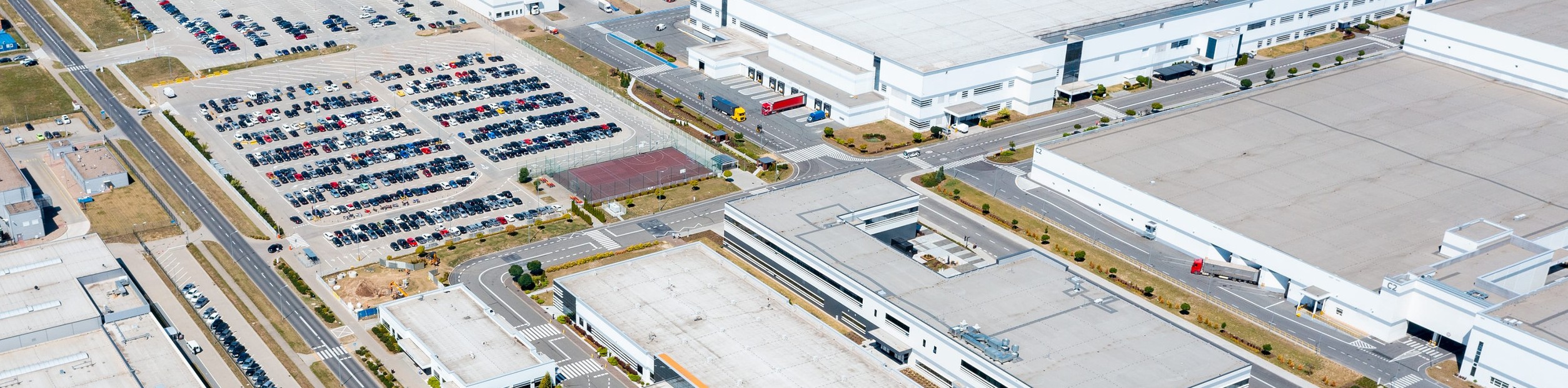 Aerial view of a large manufacturing facility illustrating industrial site selection