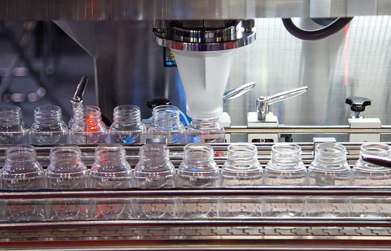 Industrial Wastewater Capacity Solutions Bottling production line inside a manufacturing facility