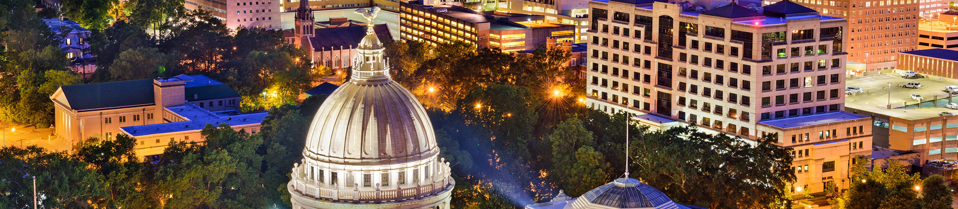 Lessons From Municipal Water System Disruptions Jackson, Mississippi skyline and State Capitol building